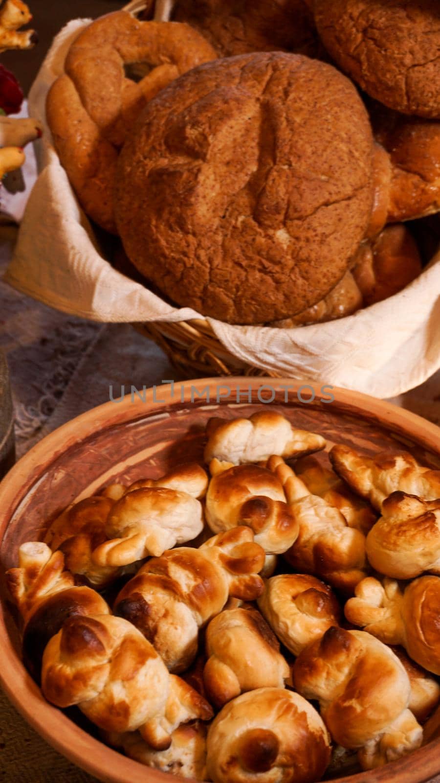 Homemade fresh sweet dough bagels in a basket. Rustic style. Fresh bakery. Vertical photo
