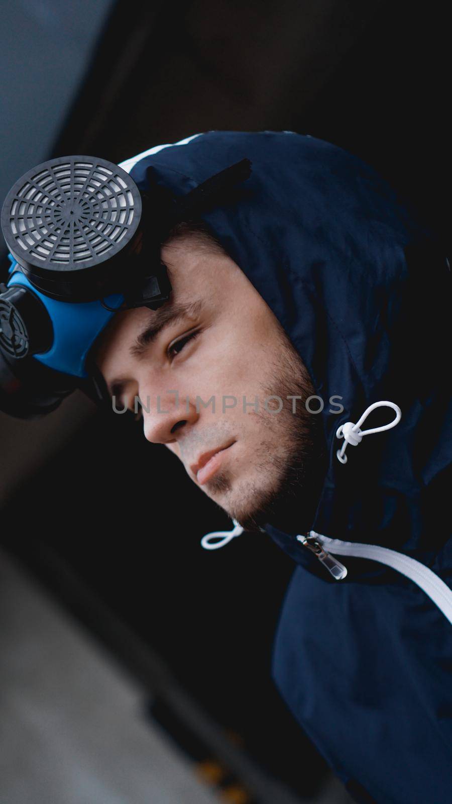 Protection respirator half mask for toxic gas.The man prepare to wear protection air pollution in the chemical industry