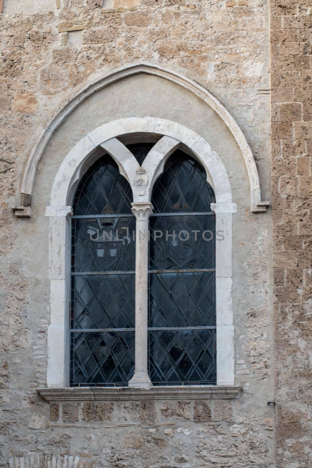 detail of the church of san francesco di terni window in the facade