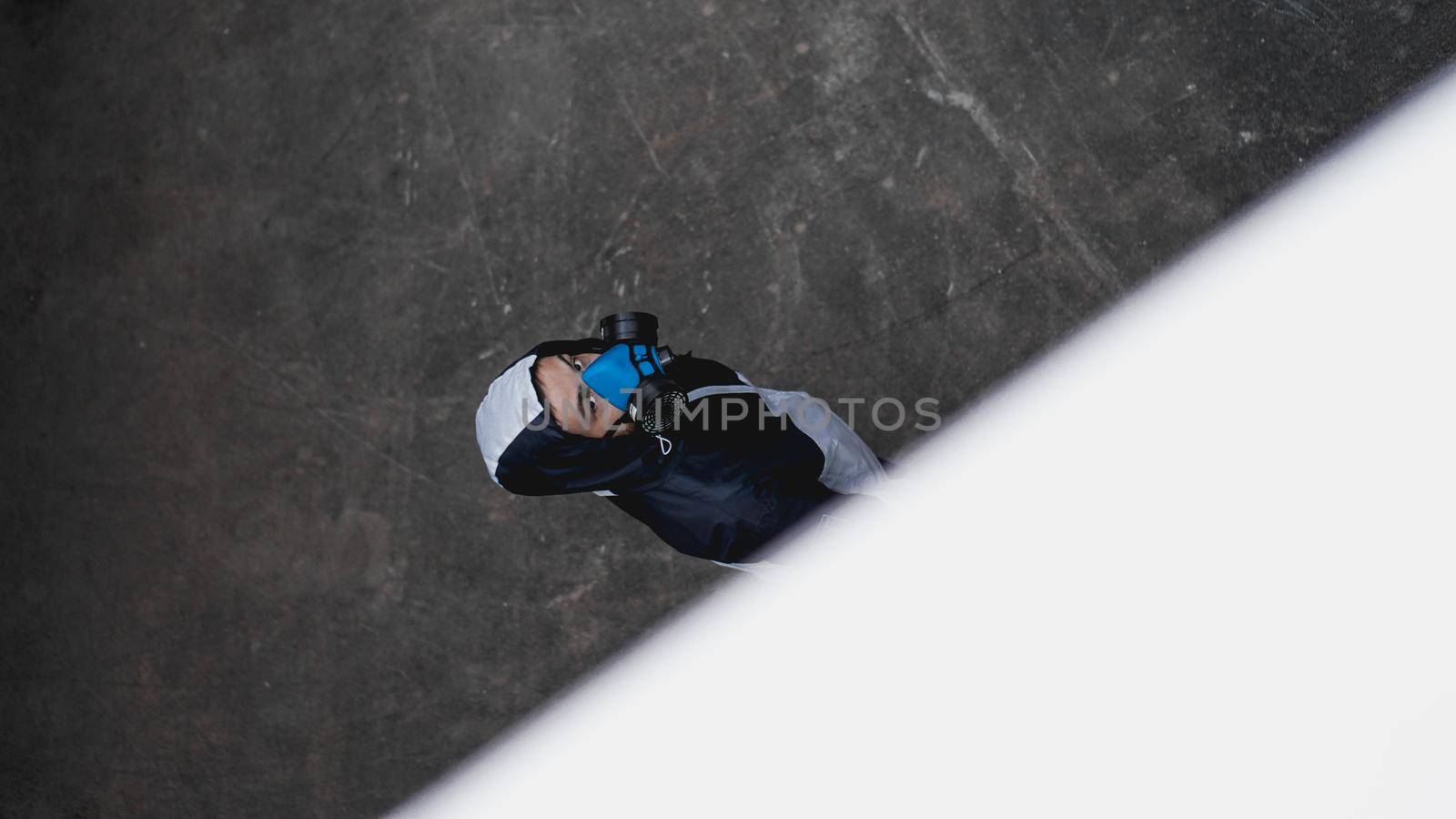 Protection respirator half mask for toxic gas.The man prepare to wear protection air pollution in the chemical industry. View from above