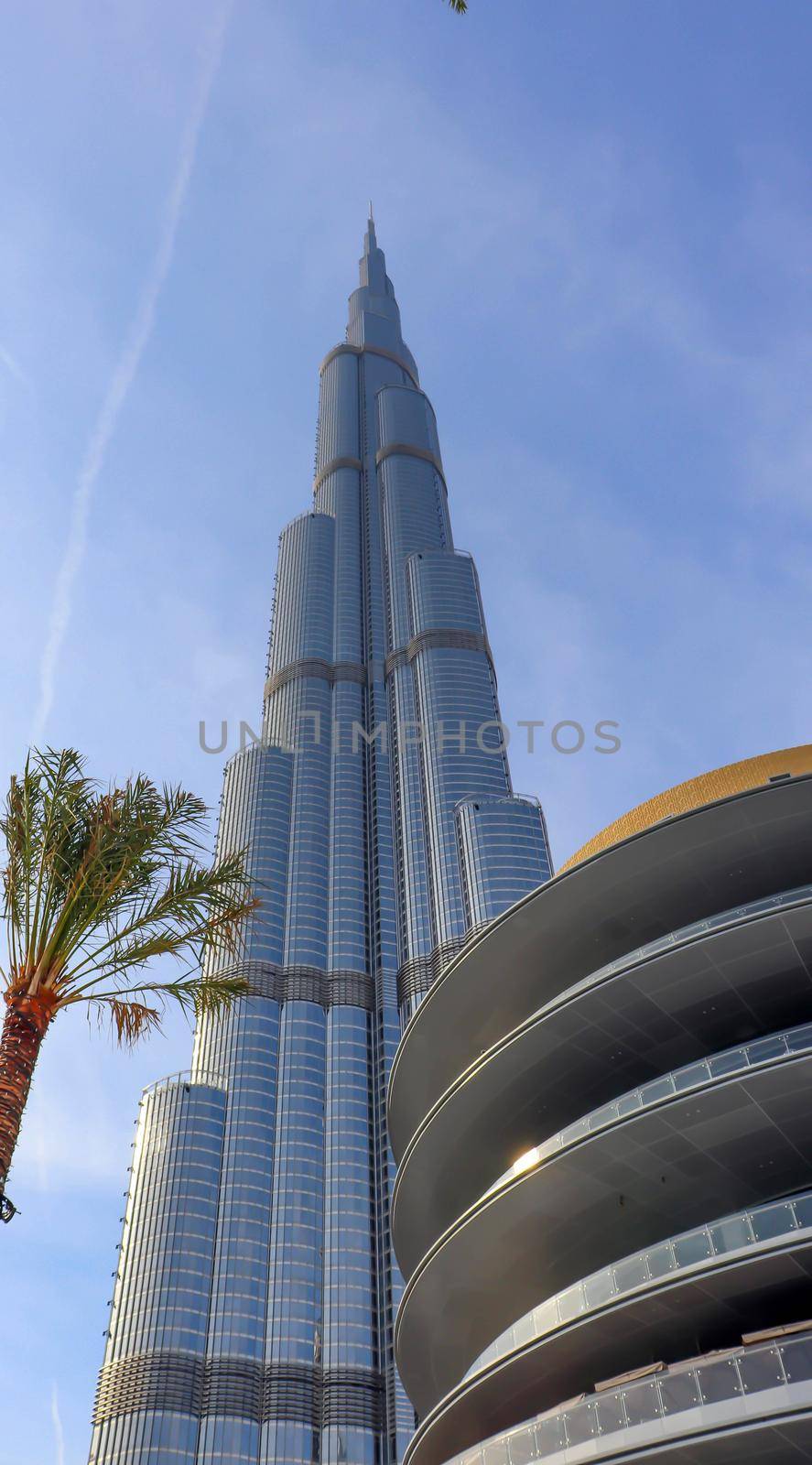 Arabic burj khalifa. Architecture building. Night dubai skyline. Dubai city background. Uae urban cityscape. Aerial view. Blue background. Panoramic view. Sky blue. United arab emirates.