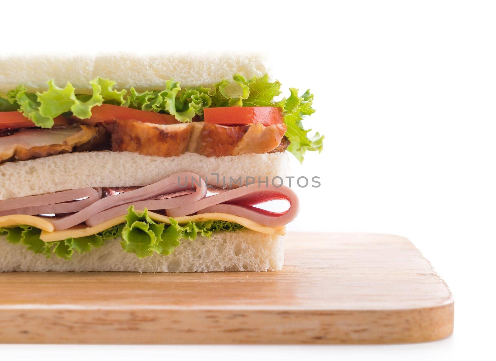 chicken and ham sandwich on white background