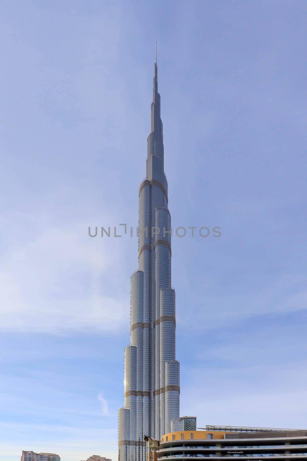 Arabic burj khalifa. Architecture building. Night dubai skyline. Dubai city background. Uae urban cityscape. Aerial view. Blue background. Panoramic view. Sky blue. United arab emirates.