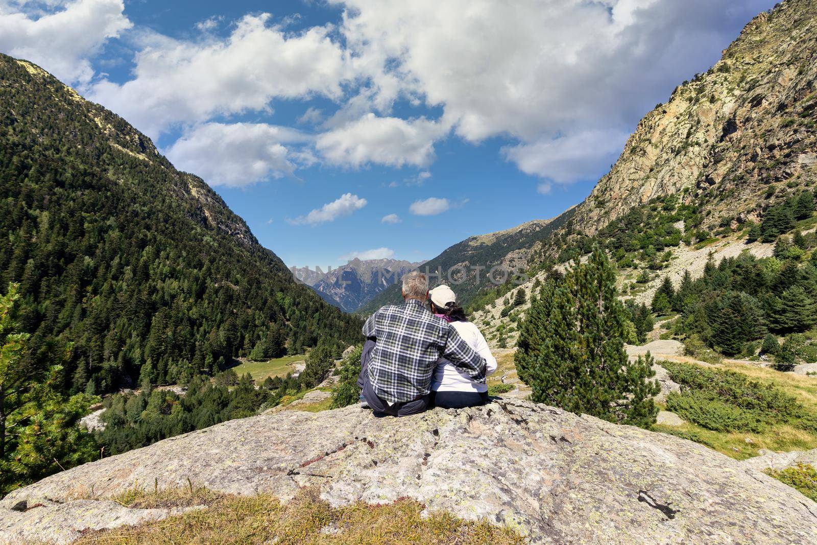 Beautiful Pyrenees mountain landscape, Sant Maurici and Augestortes, tourist couple, Spain, Catalonia by Digoarpi