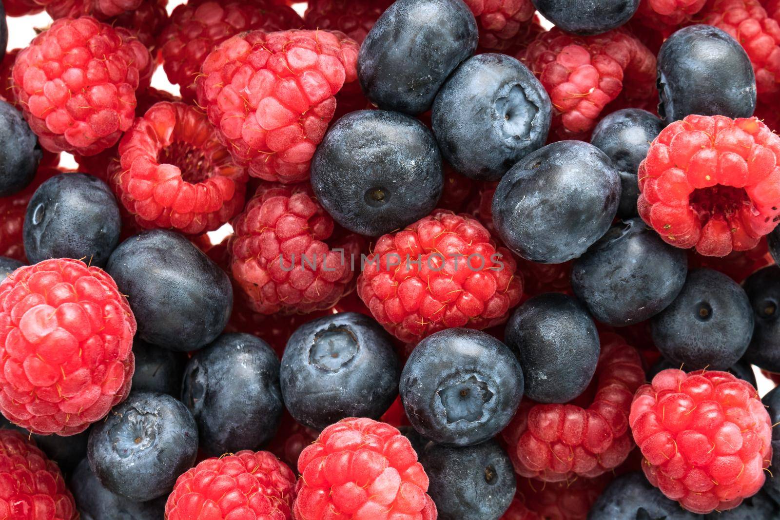 Group of Blueberry and Rasberry fruit isolated on white background