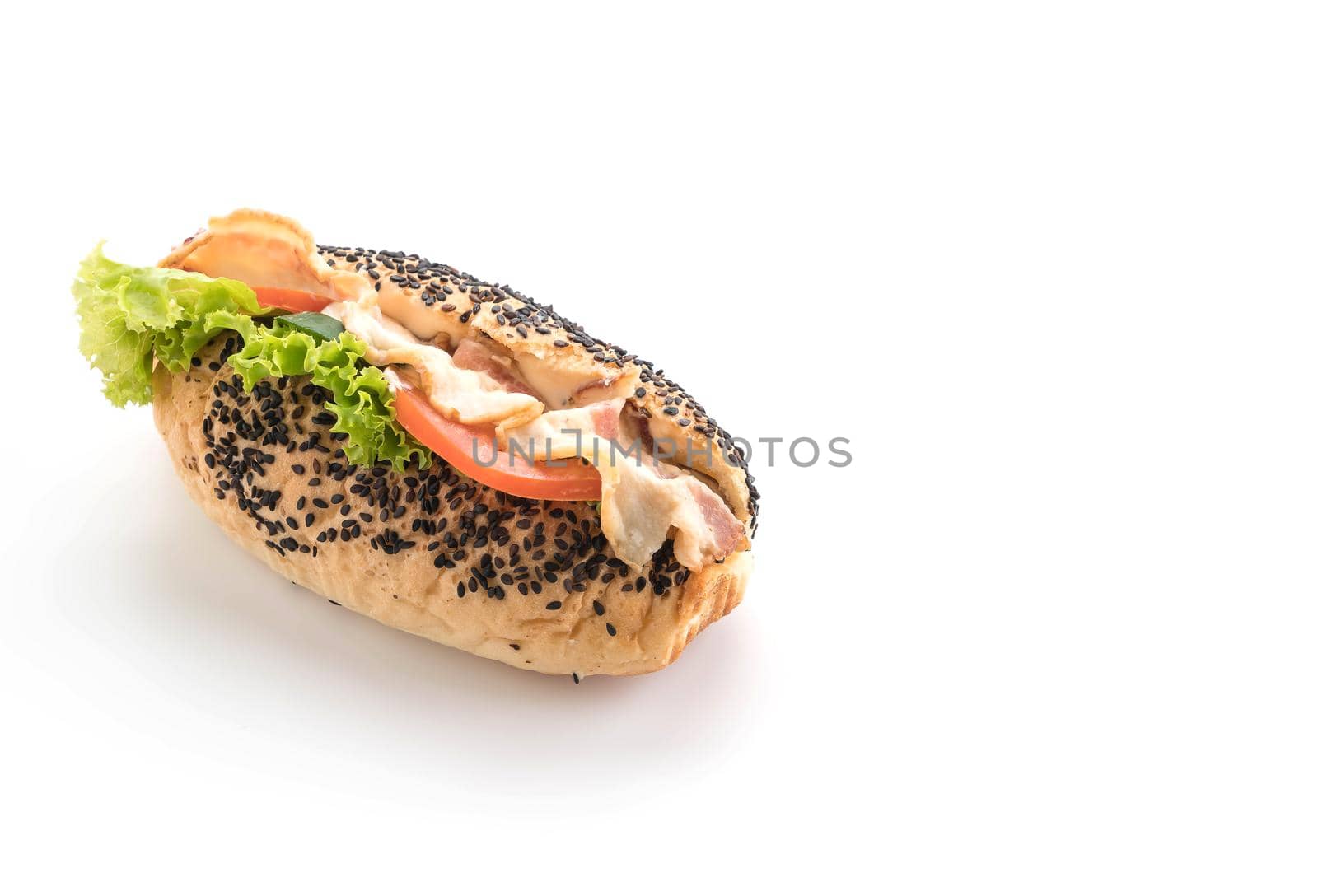 Sandwich with bacon and vegetables on white background