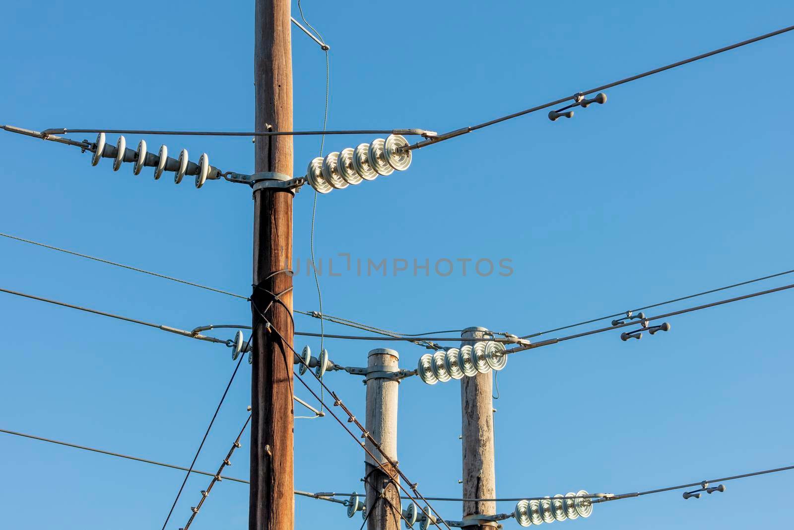 Photograph of a transmission line cable system connected to an assembly bracket