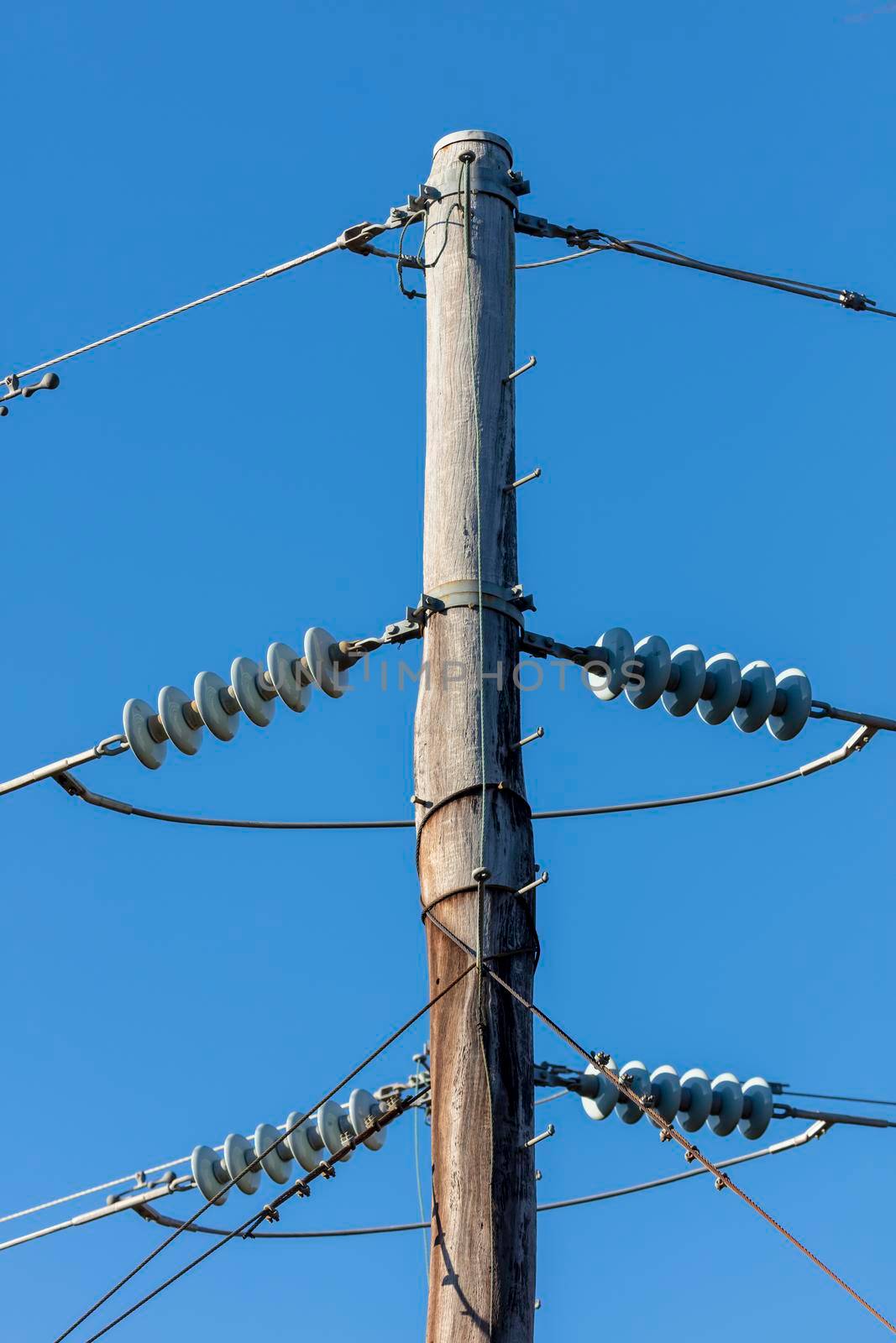 Photograph of a transmission line cable system connected to an assembly bracket