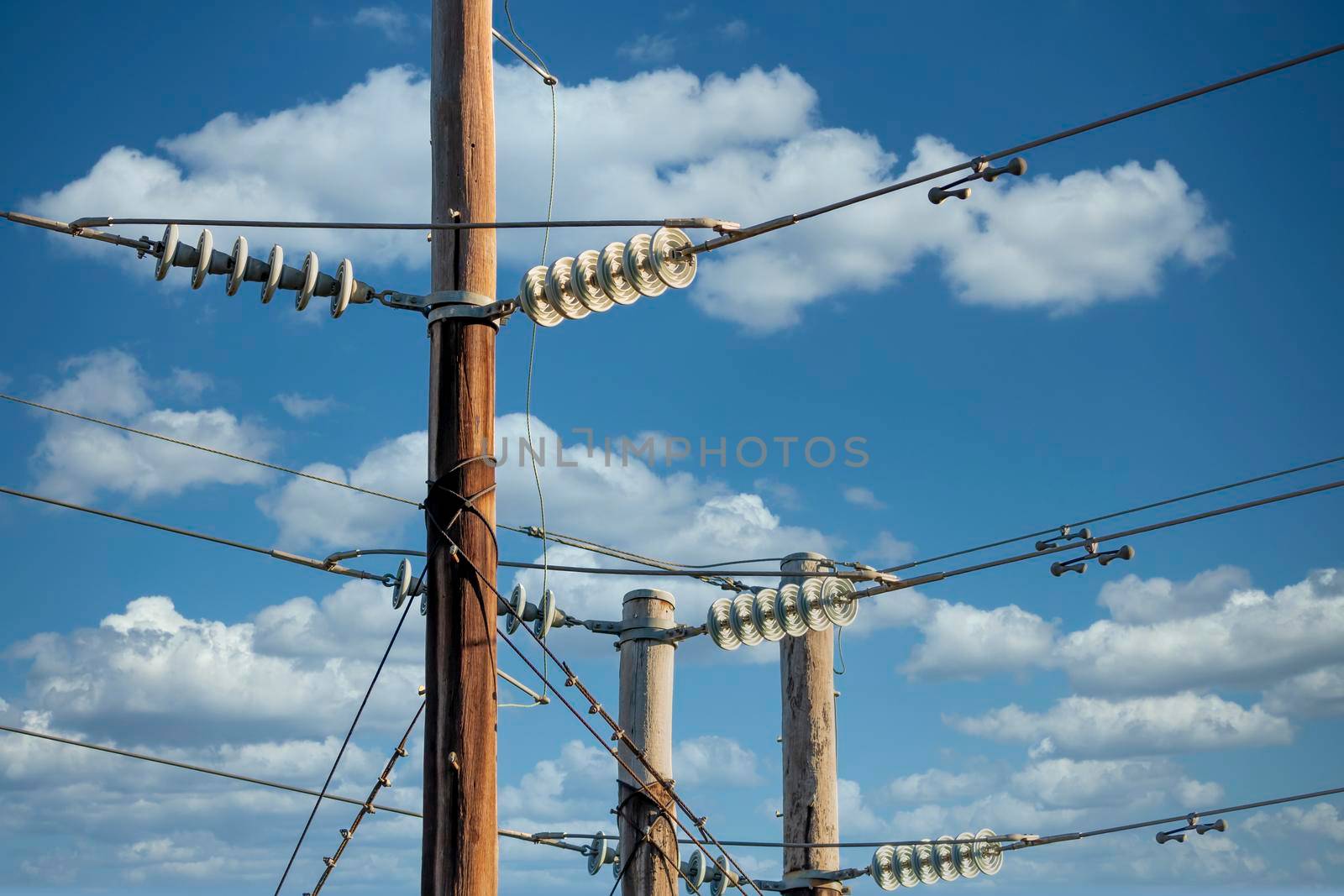 Photograph of a transmission line cable system connected to an assembly bracket