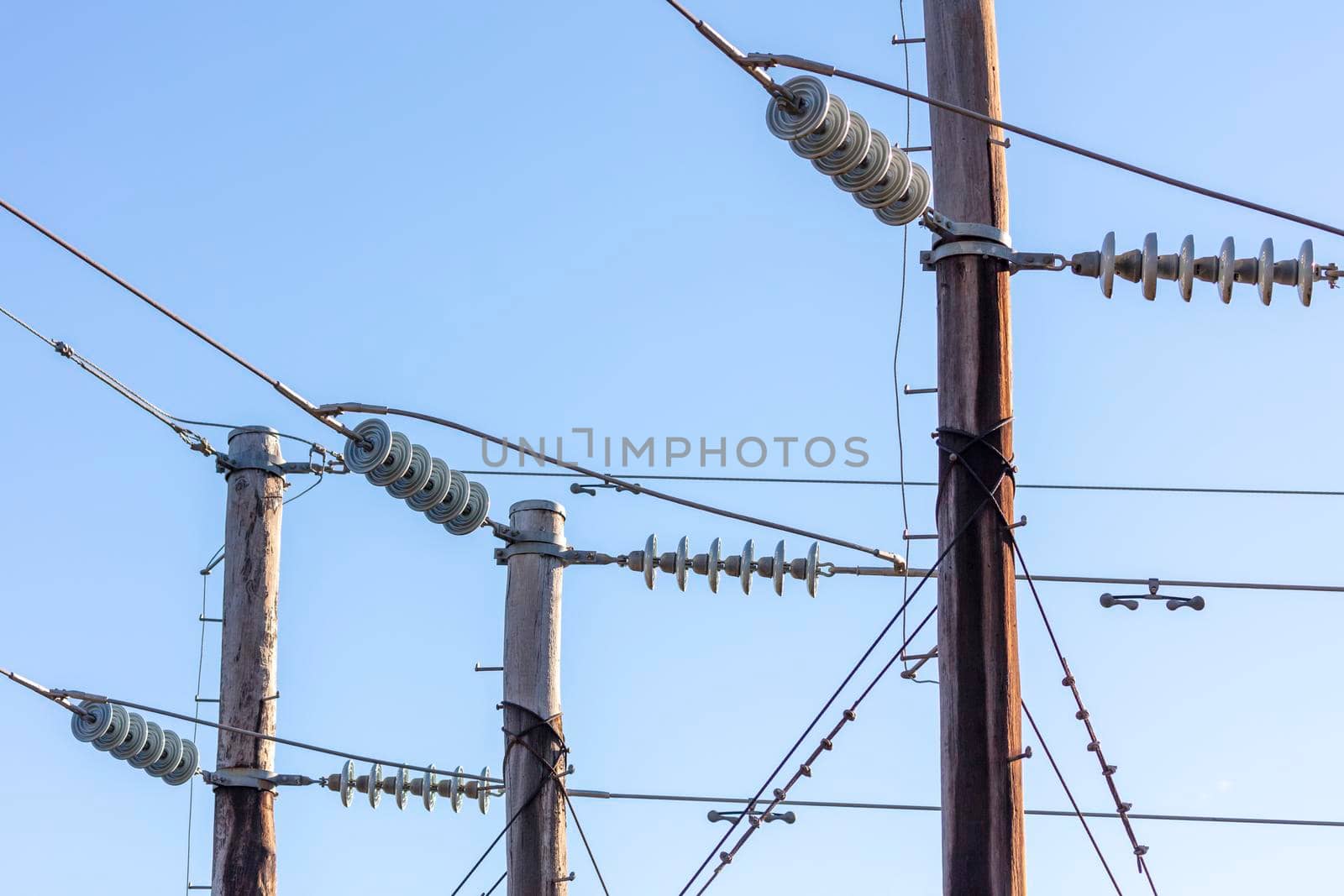 Photograph of a wooden telephone post and cables by WittkePhotos