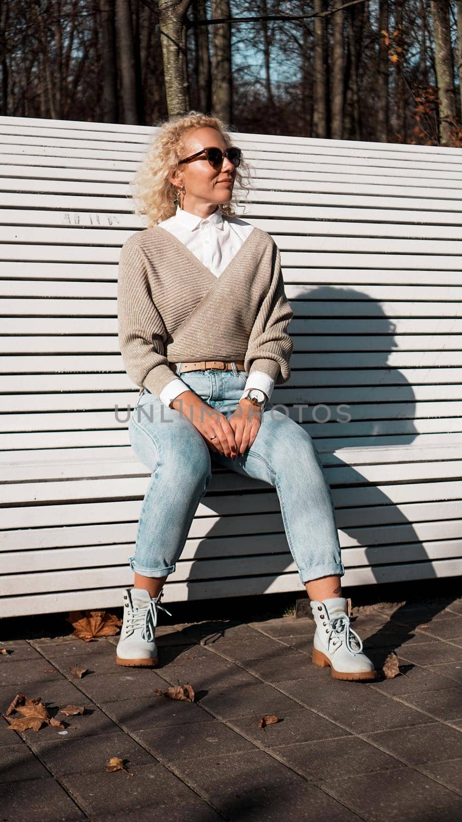 Pretty woman on bench at autumn park alone, lifestyle people concept by natali_brill