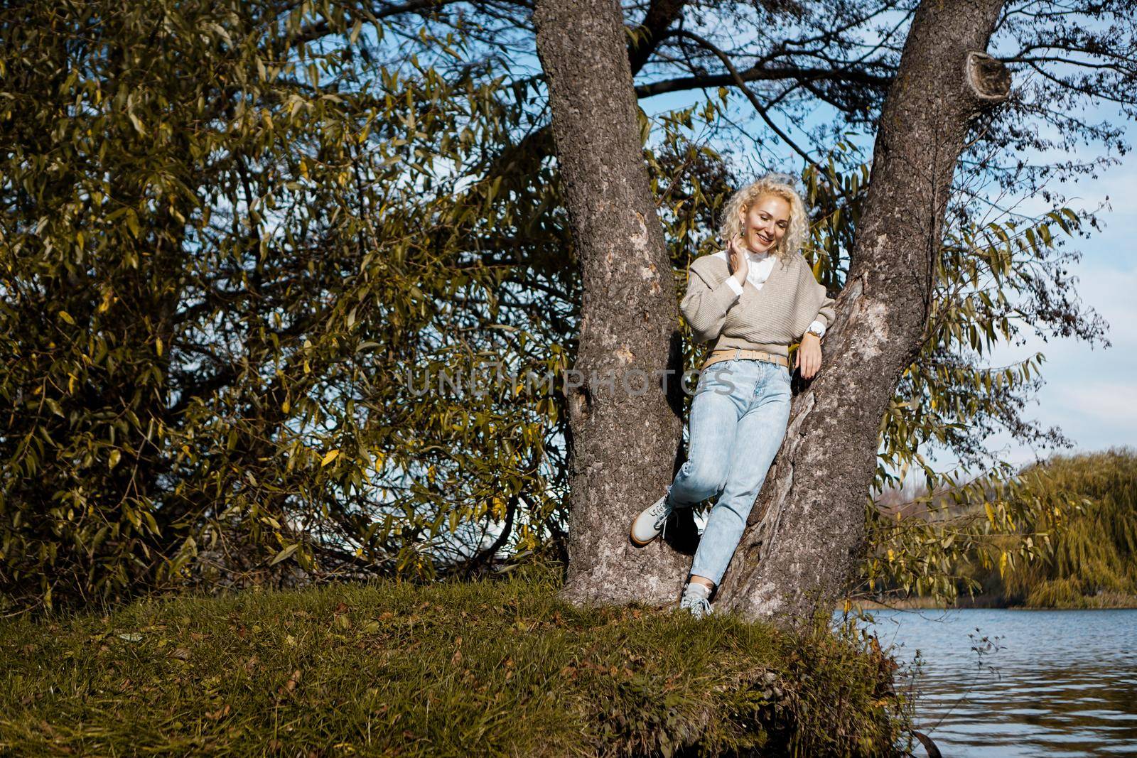 Attractive middle aged woman looking at River and smiling