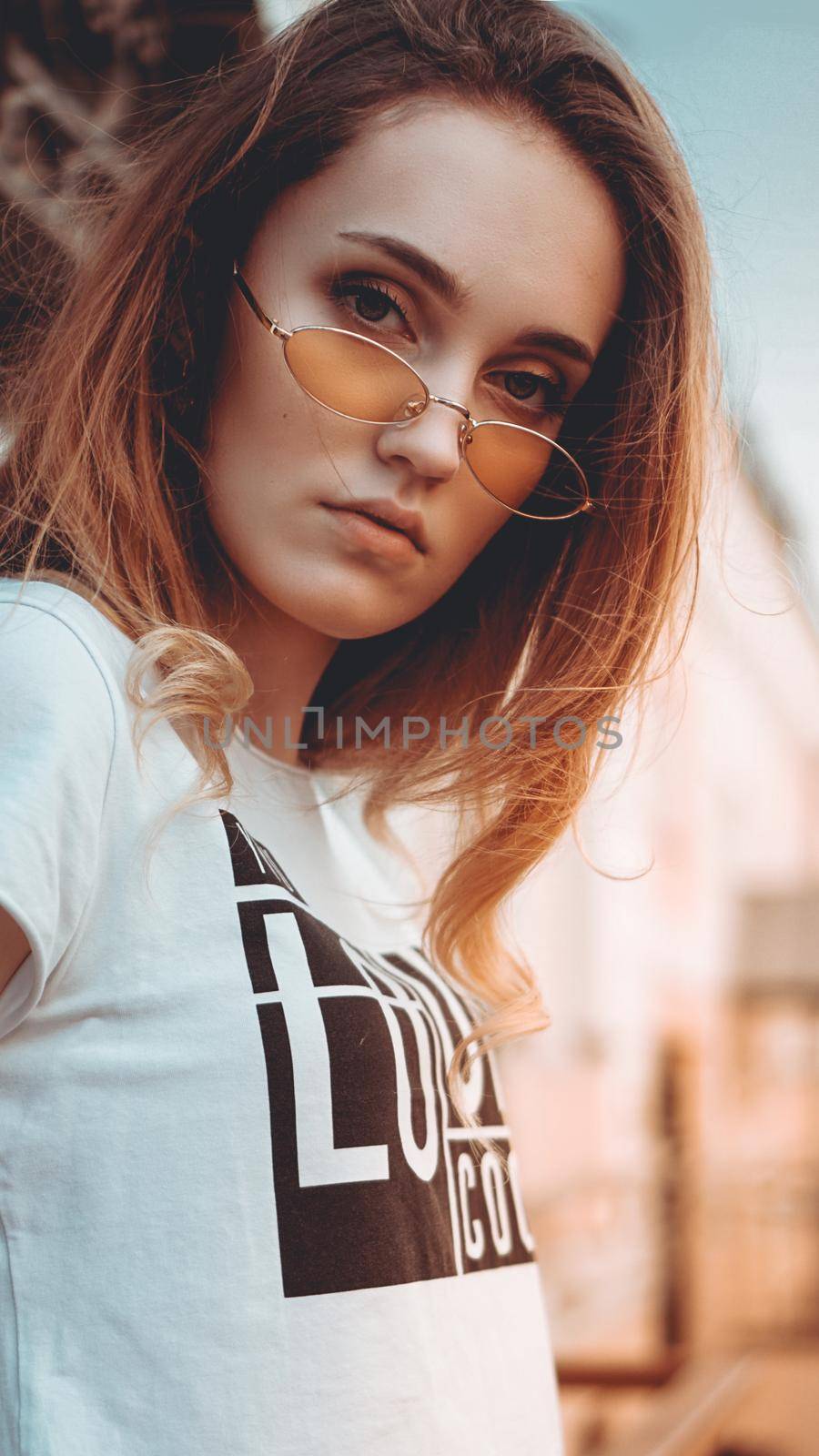 Fashion portrait stylish pretty woman in sunglasses posing in the city by natali_brill