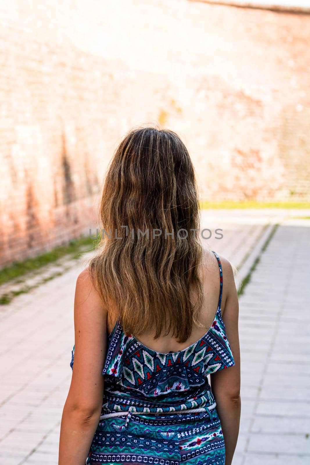 Young beautiful girl visiting the citadel of Alba Iulia, Romania. by vladispas