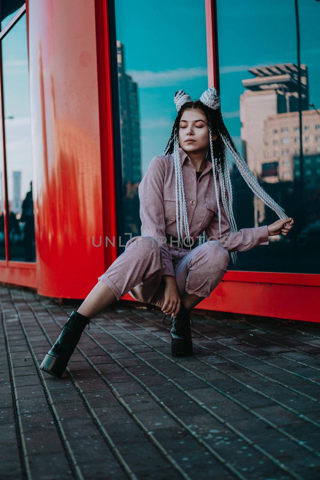 Beautiful cool girl with dreadlocks Photo in the city - urban style