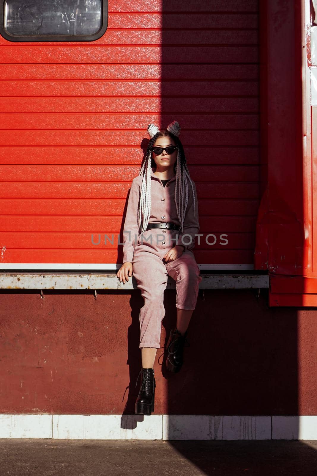 Beautiful cool girl over urban wall. Sunny day. Girl in sunglasses by natali_brill