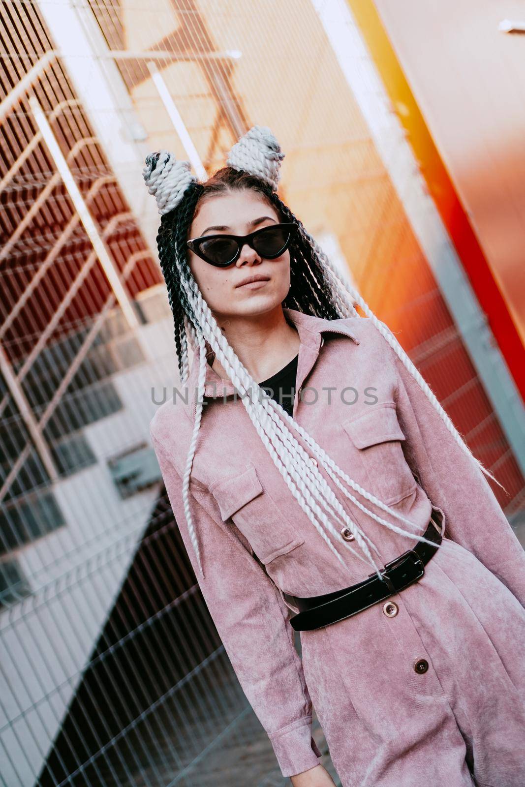 Portrait of beautiful cool girl over urban wall. Sunny day. Girl in sunglasses by natali_brill