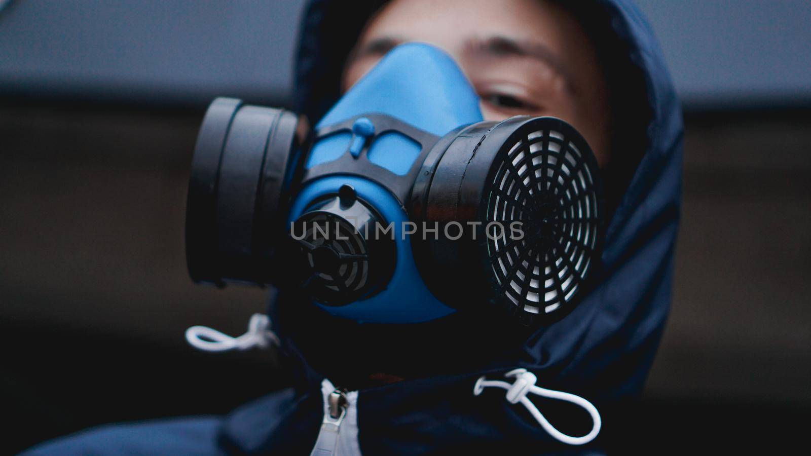 Protection respirator half mask for toxic gas.The man prepare to wear protection air pollution in the chemical industry