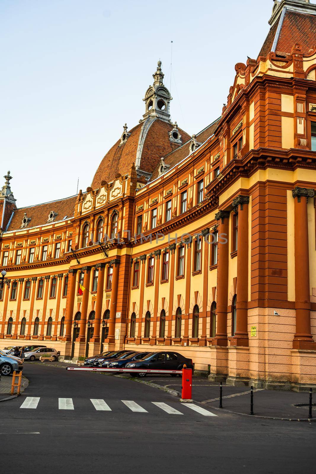 View of Justice Palace facade building which currently houses the Brasov Prefecture, the County Council and the Court of Appeal. Brasov, Romania. Exterior architectural details