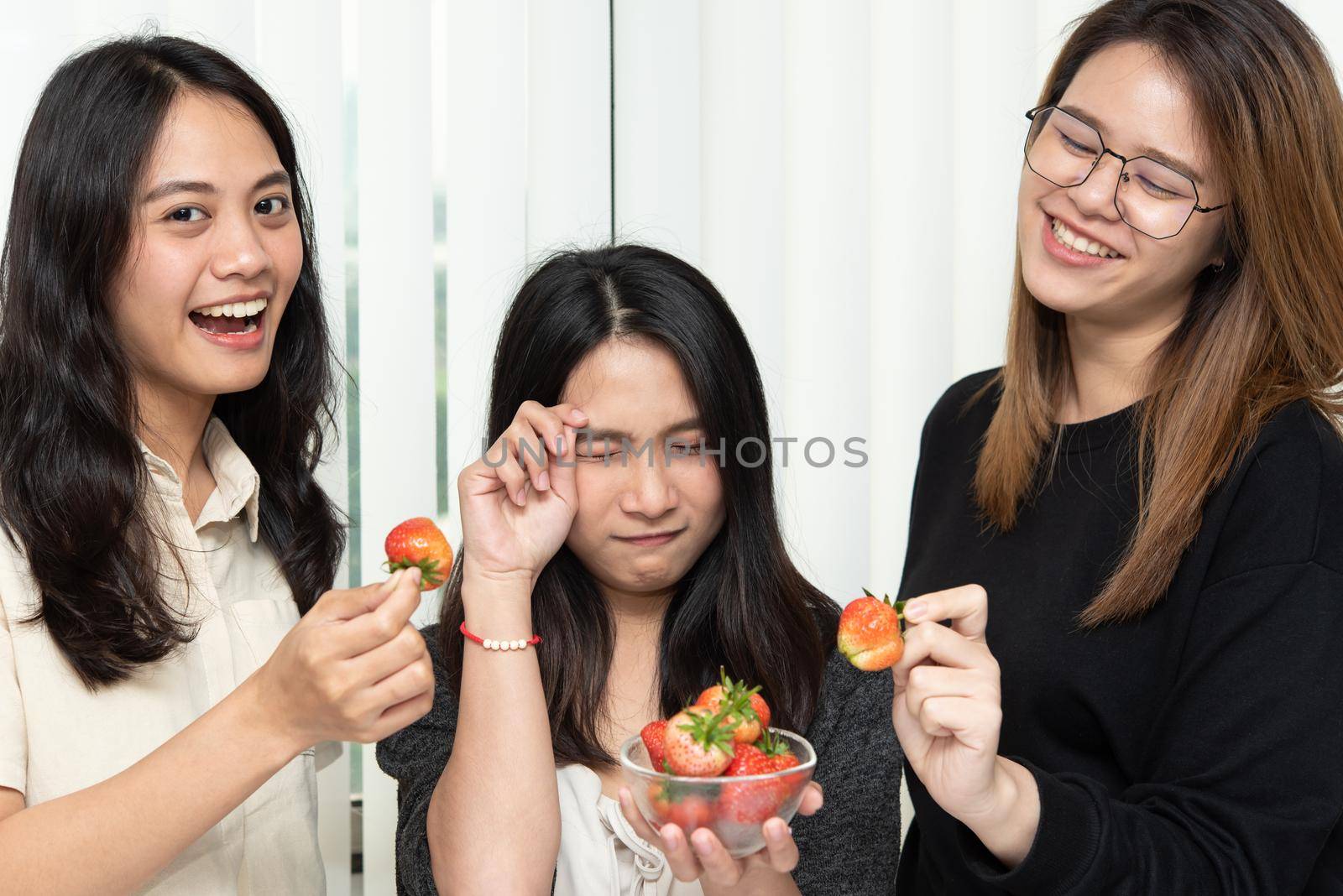 Women eat strawberry red berry fruit sweet juicy by PongMoji