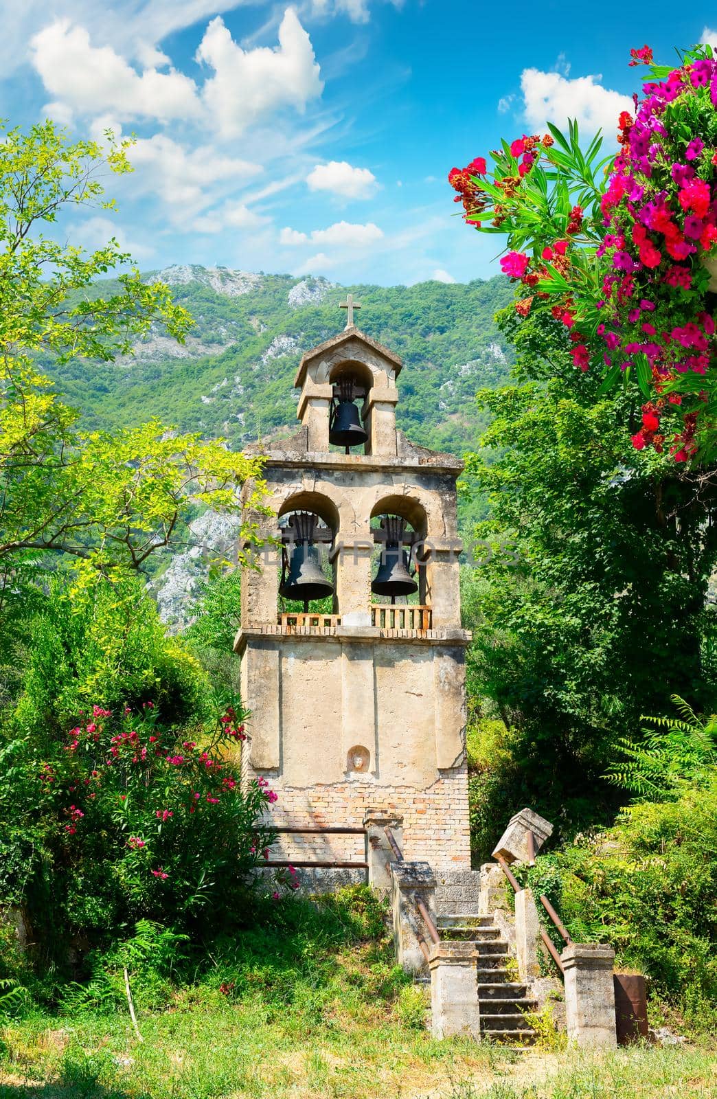 Bell tower in the back yard of church in Prcanj, Montenegro