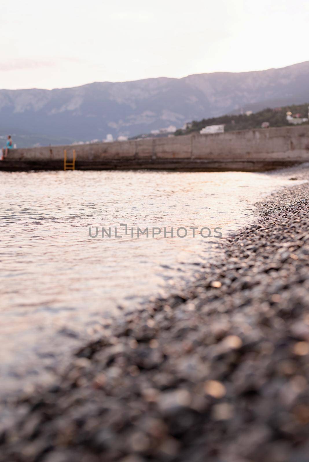pebble stones beach in Crimea and the sea, nature background
