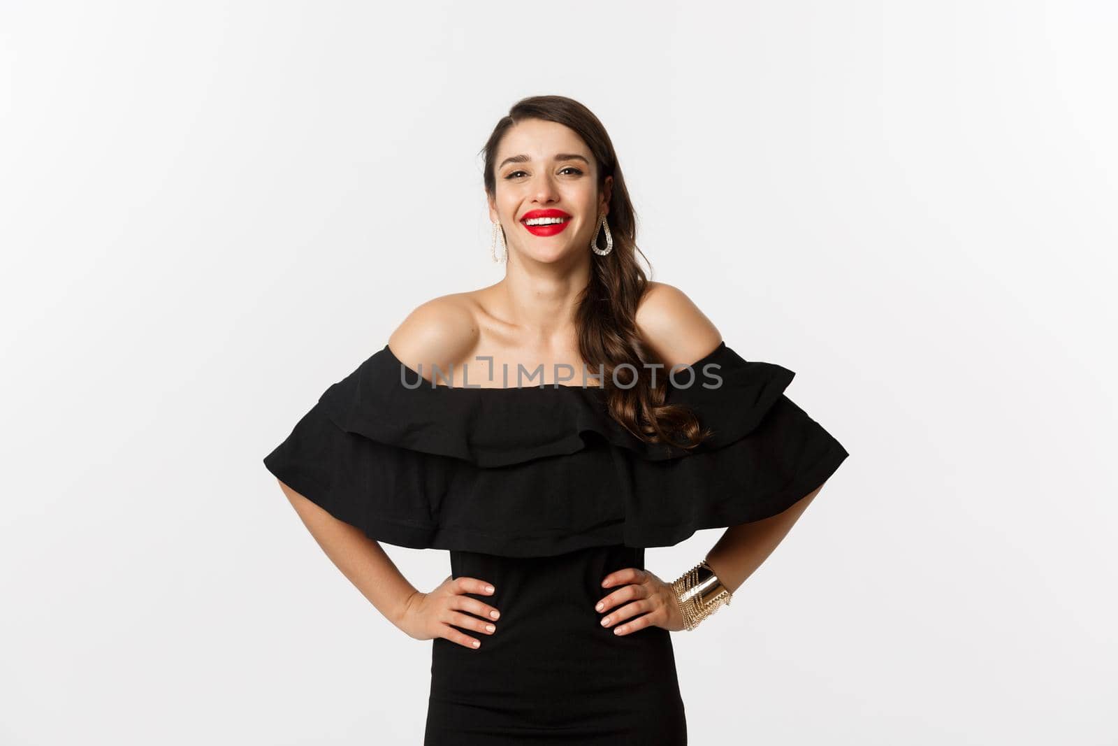 Beauty and fashion concept. Elegant young woman wearing party dress and red lipstick, laughing at camera, standing cheerful against white background by Benzoix