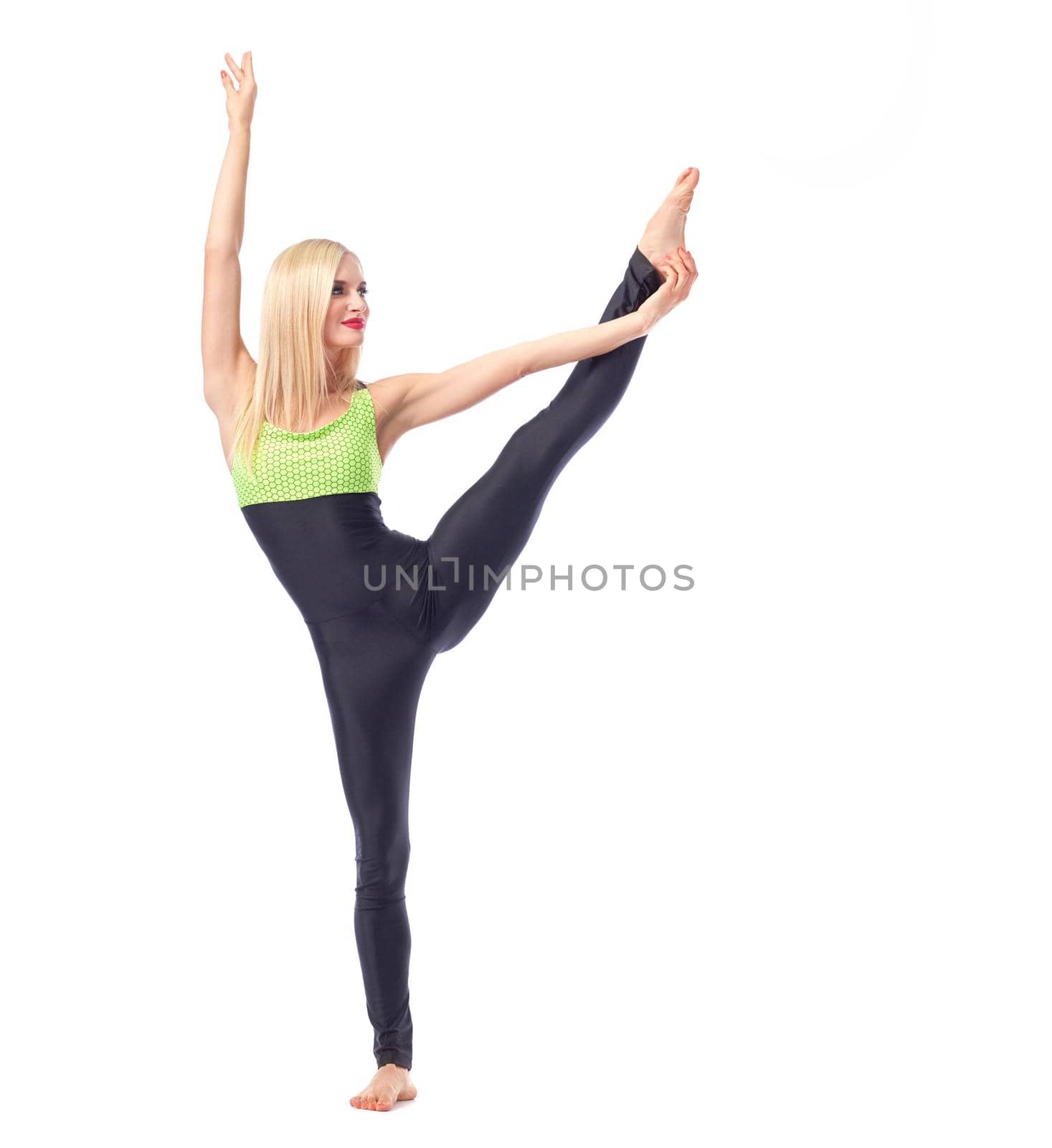 Get fit. Beautiful female gymnast doing leg stretching exercise isolated gymnastics gym activity sportive concept