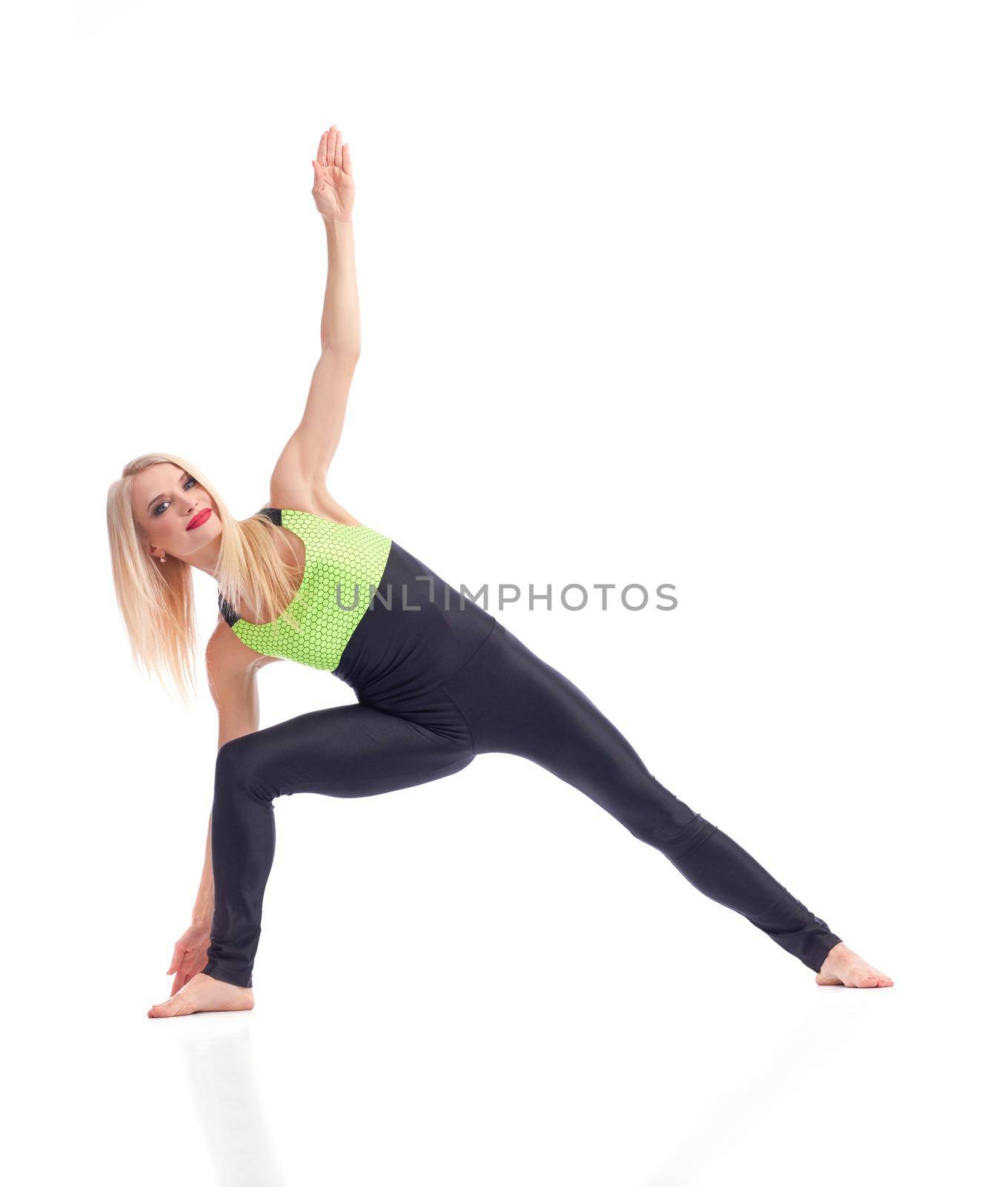 Yoga keeps her relaxed. Studio shot of an attractive female standing in yoga position isolated on white copyspace yoga training fitness sports health coach concept