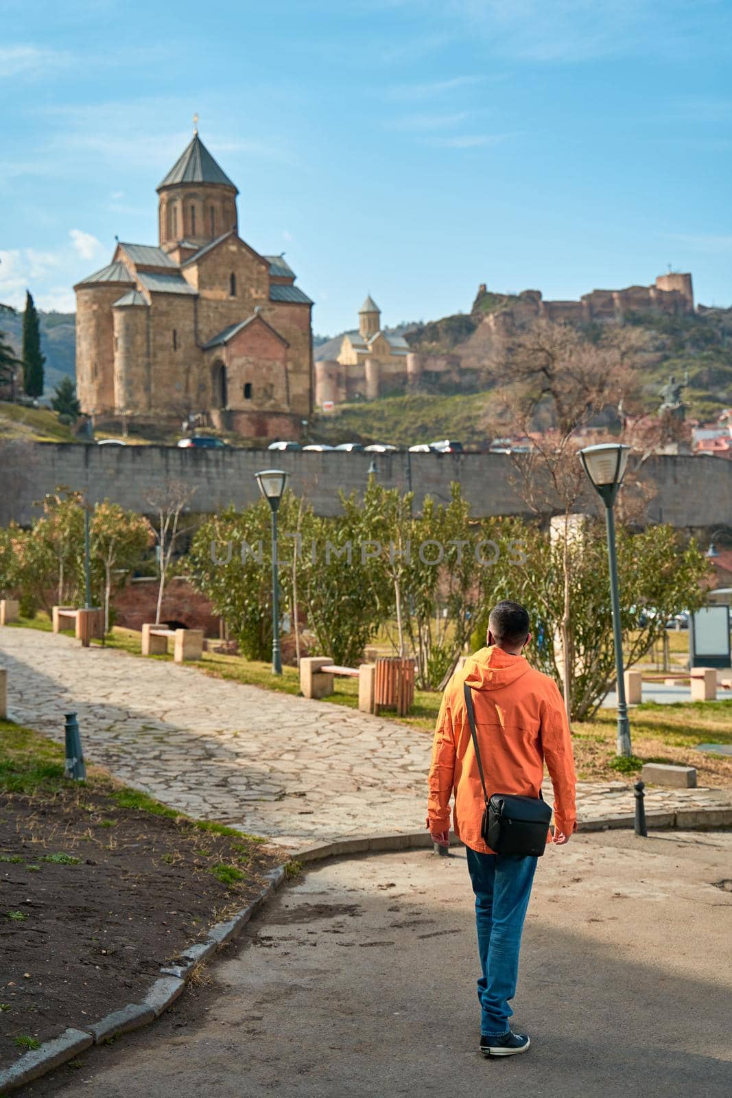 The guy walks up the hill to the Old Georgian-style church. Metekhi monastery in Tbilisi by Try_my_best