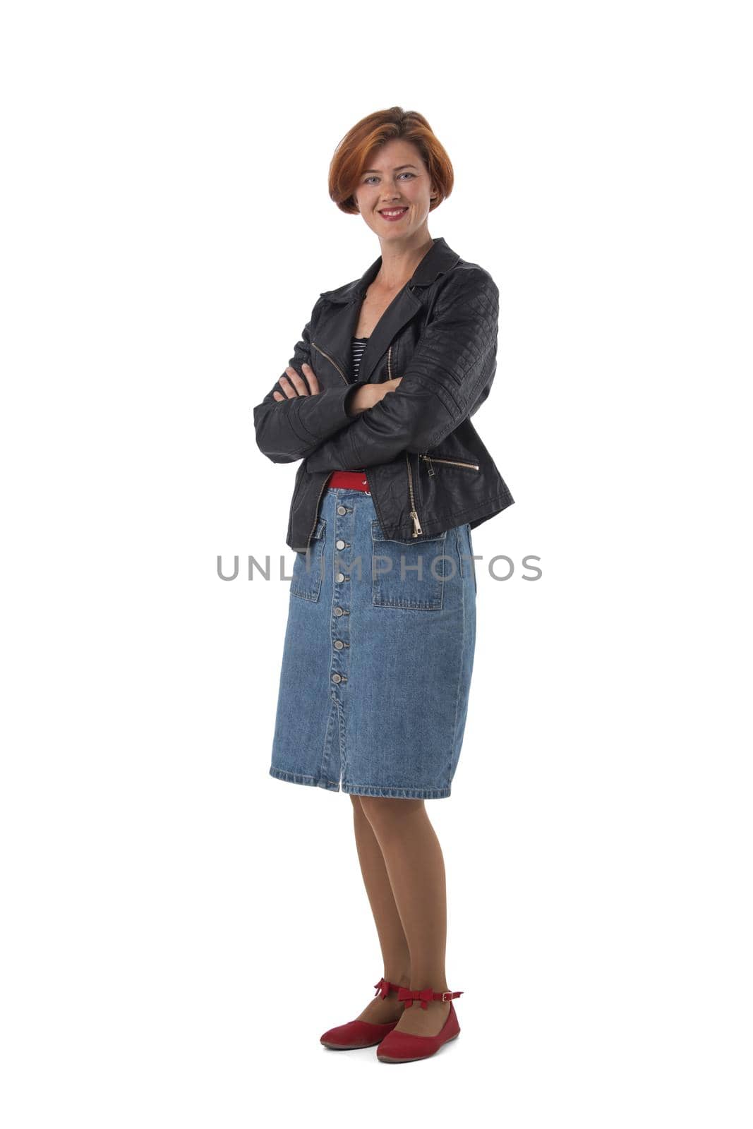 Casual smiling woman standing with arms folded in full length isolated on white background