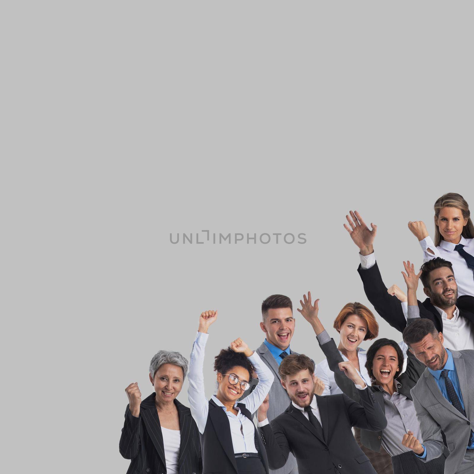 Large and very happy business group of people with arms raised over gray background corner design element