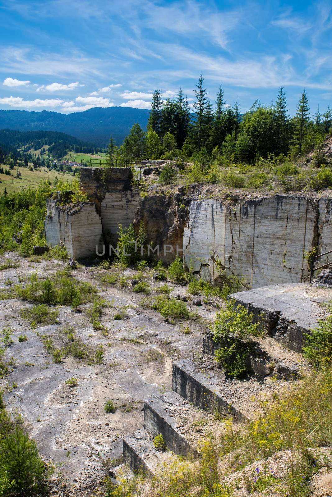 Travertine layers in old stone quarry in a summer scene