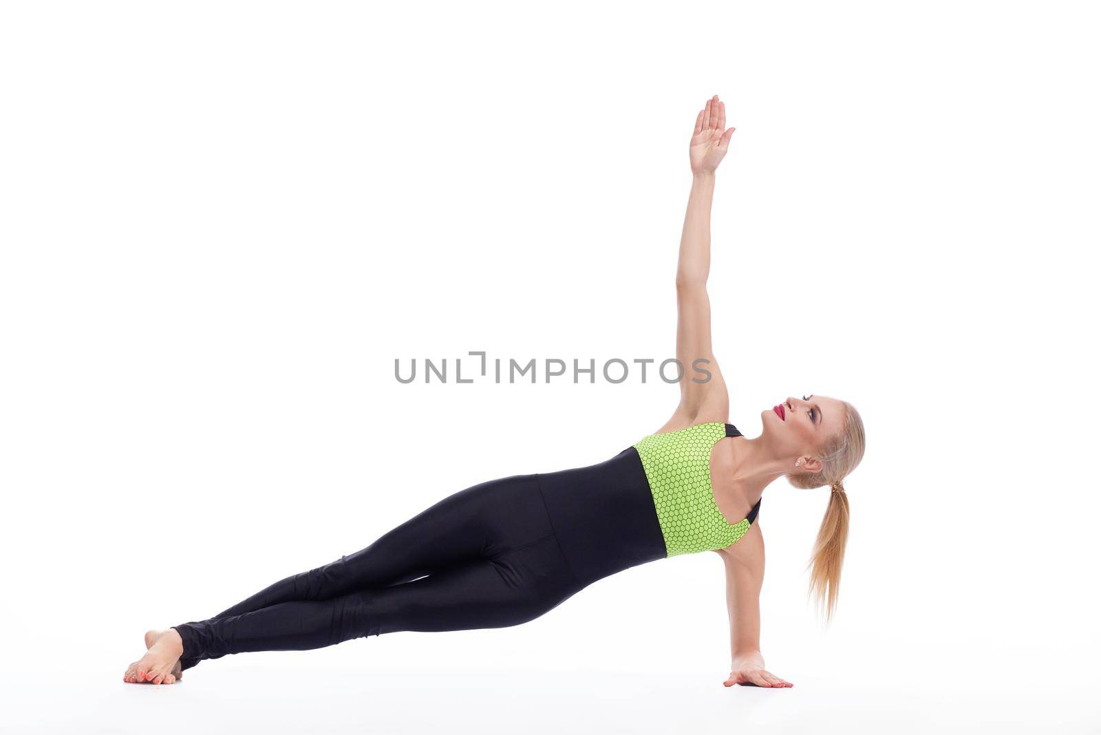 Better living through sports. Beautiful blonde female practicing yoga isolated on white yoga sports fitness life health concept