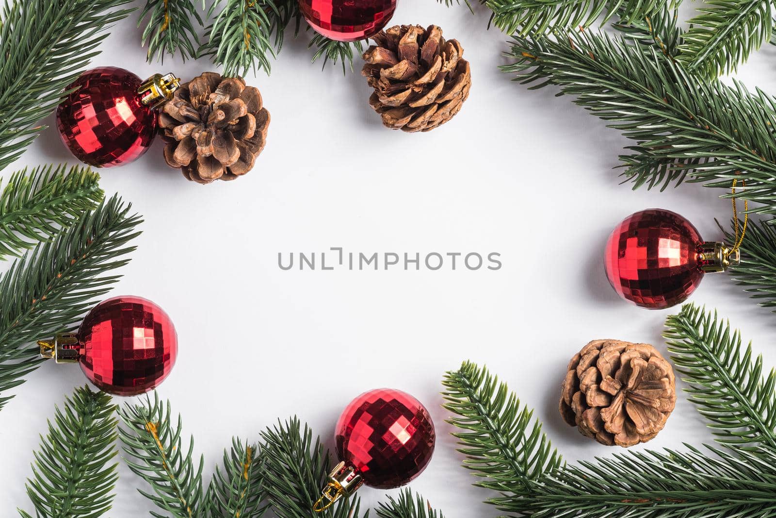 Christmas holidays copy space composition red baubles, pine cones and fir-tree branches. by Frostroomhead