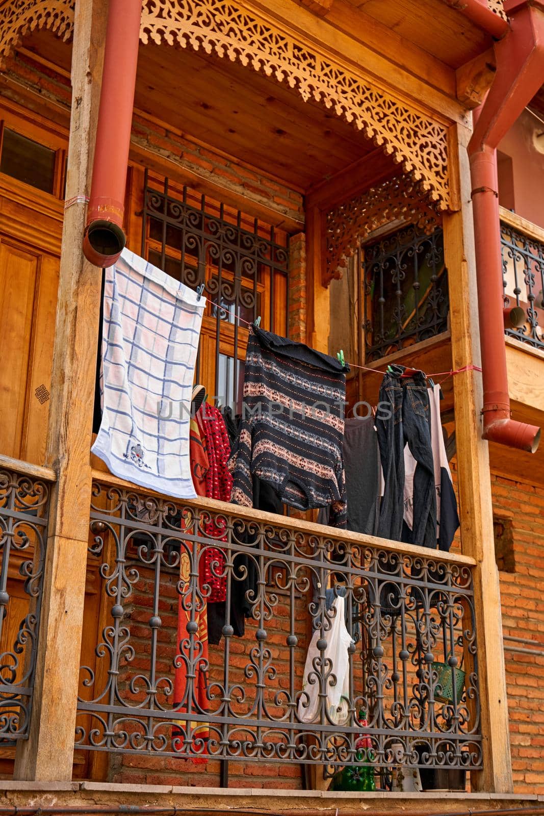 Household traditions in Georgia. The washed laundry is dried on the balcony outside.