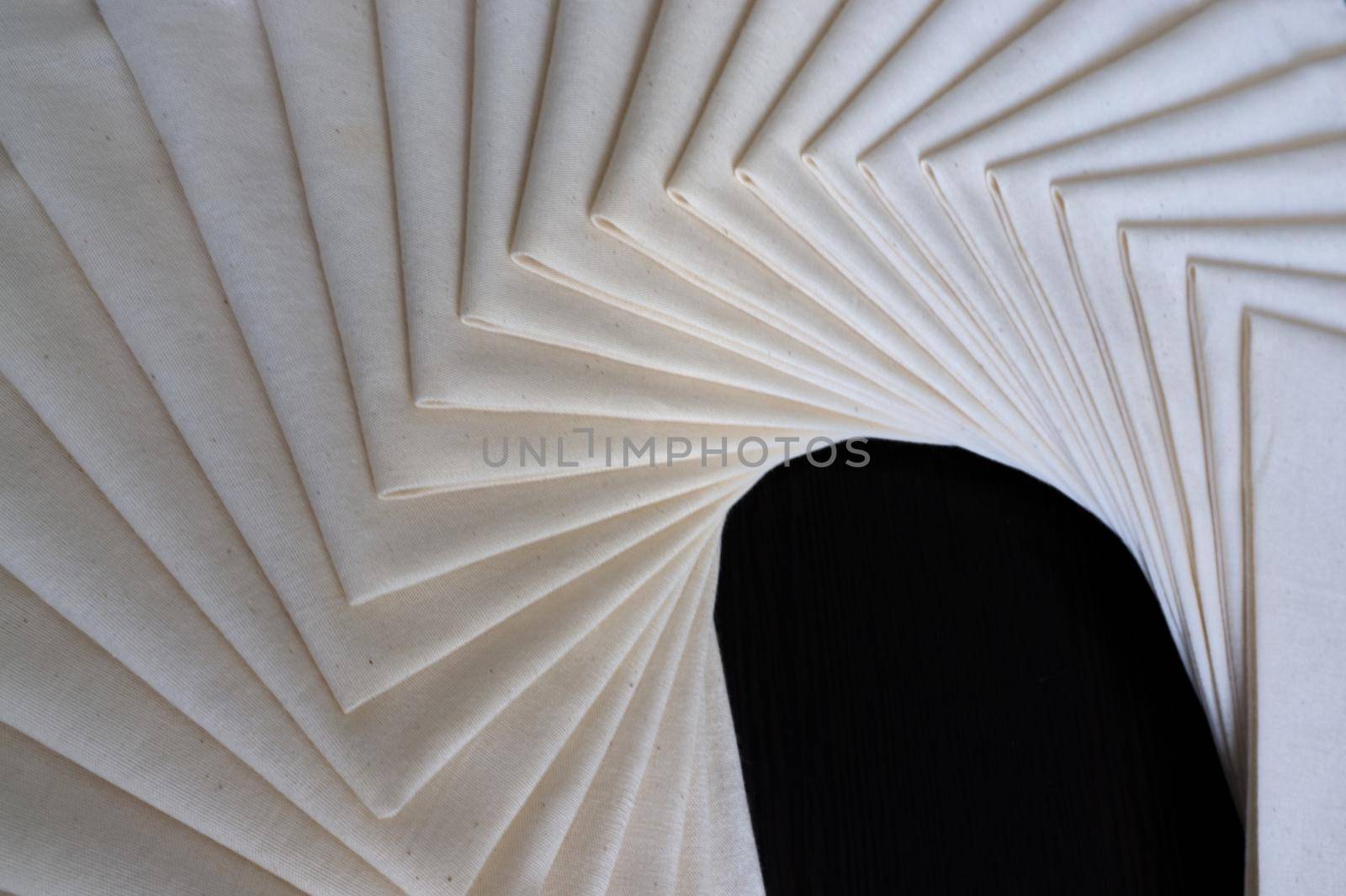 White Fabric folded of stacked . Fabric texture background . Concept workshop