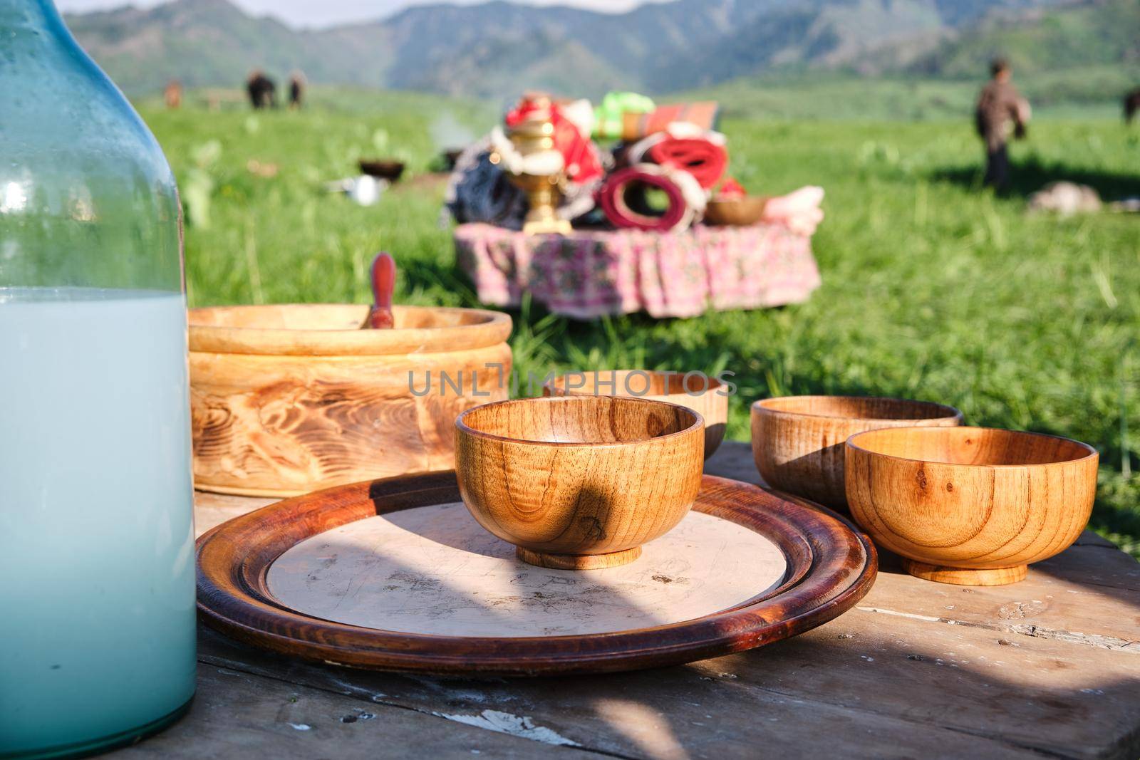 Wooden dishes on the table on the background of nature, Kazakhstan