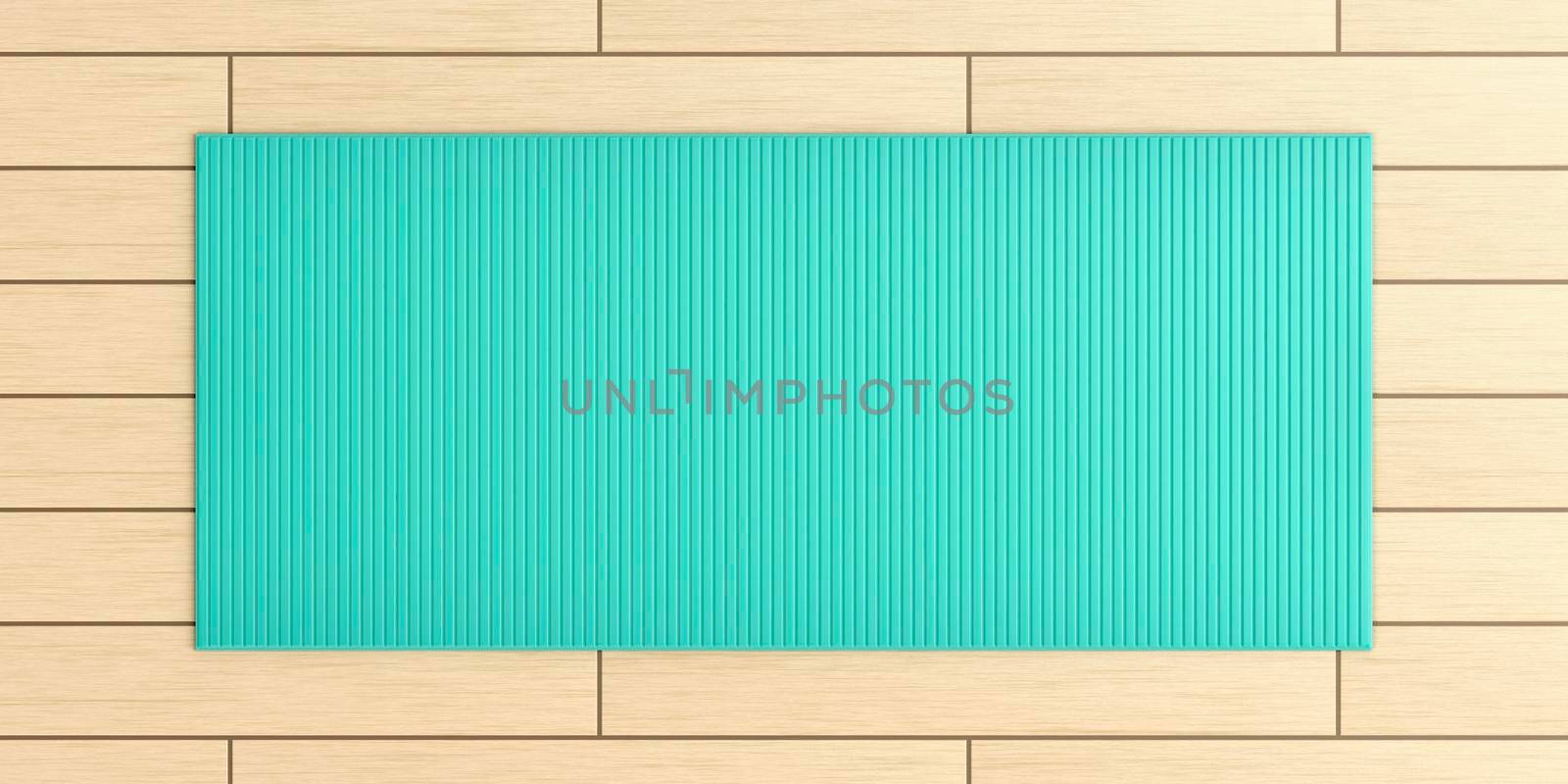 Top view of yoga mat on wood floor