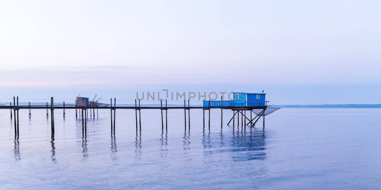 Hut of fishermen in blue sunset in Yves bay, France