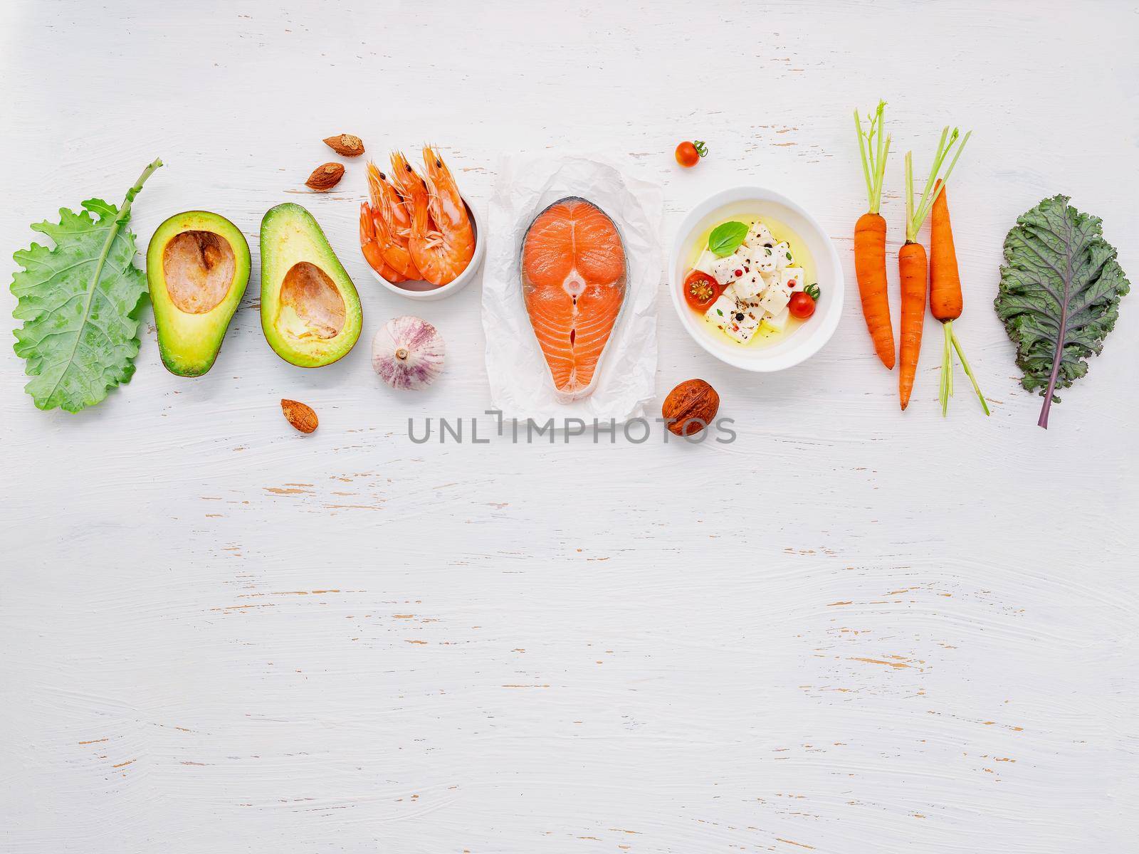 Ketogenic low carbs diet concept. Ingredients for healthy foods selection set up on white wooden background. by kerdkanno