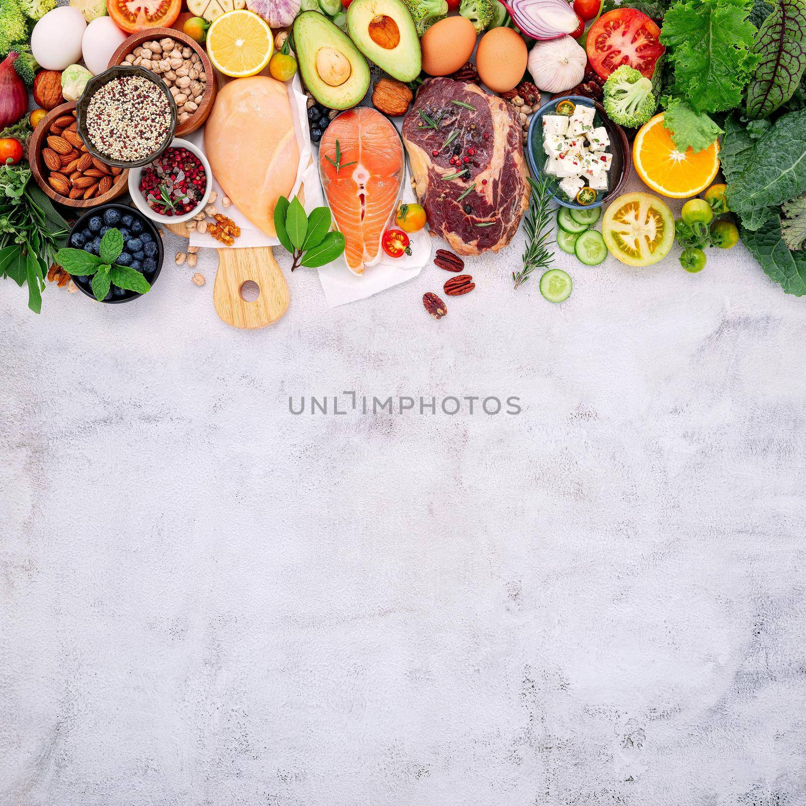 Ketogenic low carbs diet concept. Ingredients for healthy foods selection set up on white concrete background. by kerdkanno