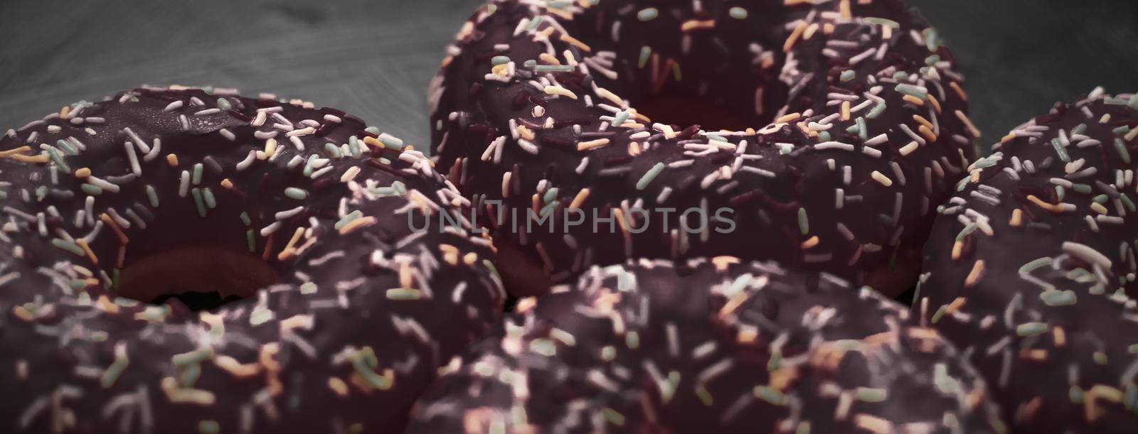 Bakery, branding and cafe concept - Frosted sprinkled donuts, sweet pastry dessert on rustic wooden background, doughnuts as tasty snack, top view food brand flat lay for blog, menu or cookbook design