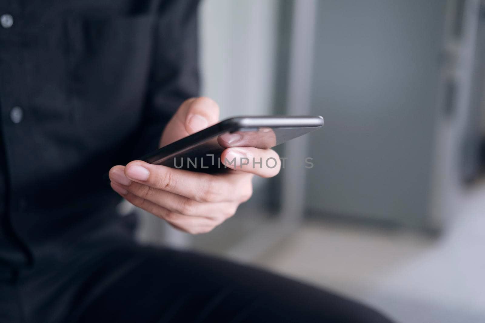 Young man using mobile phone. Using online connect technology for business, education and communication. 