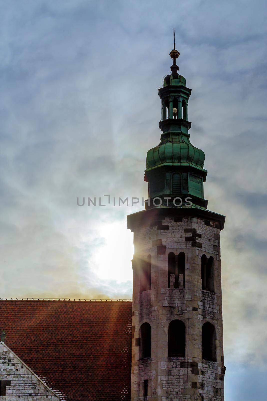 Church Saints Peter Paul Old Town, Krakow, Poland. Bell tower in the sun rays through the clouds