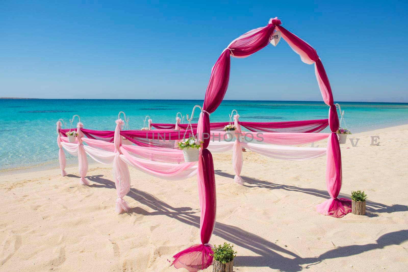 Wedding aisle setup on tropical beach by paulvinten