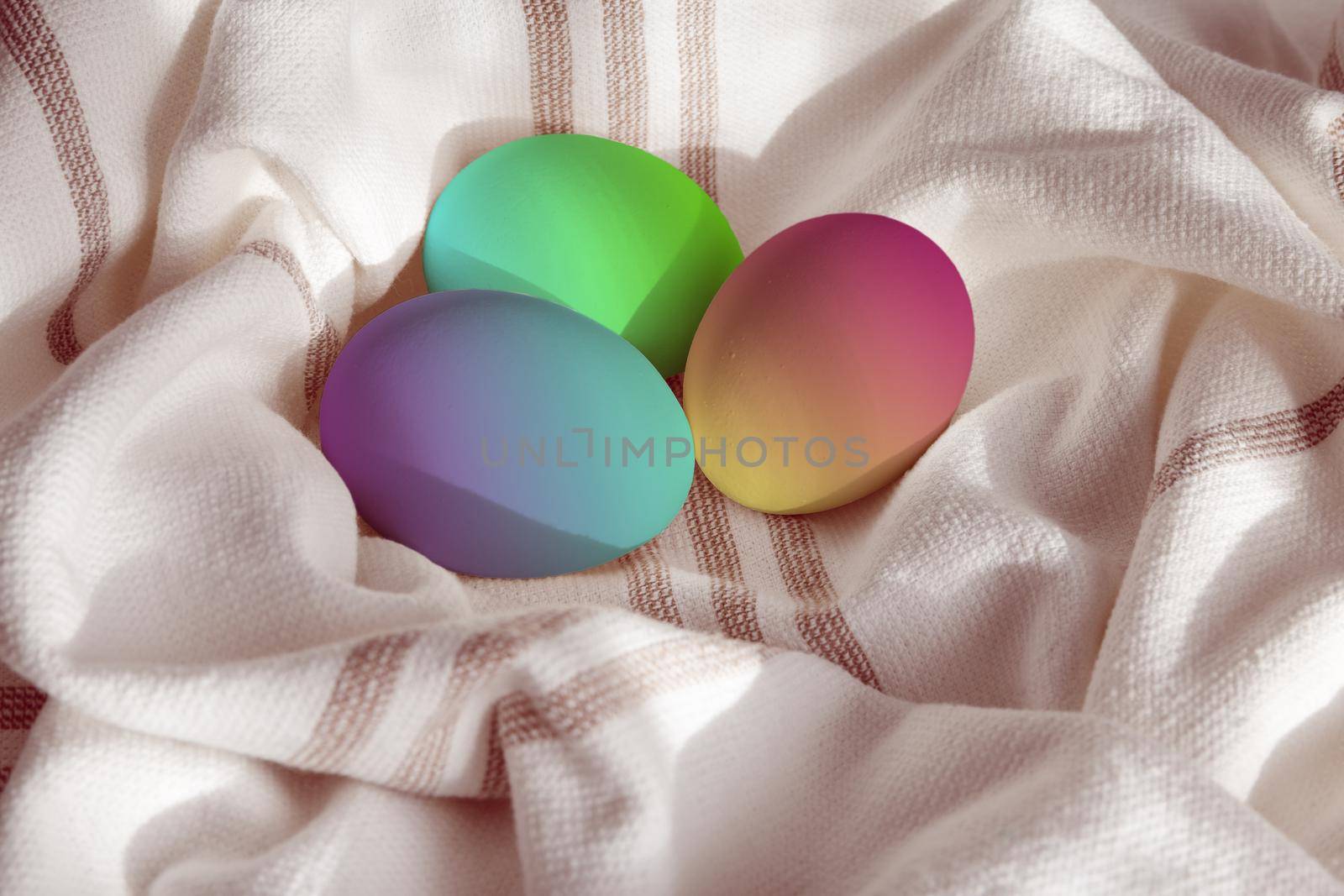 Painted easter fresh chicken eggs on a linen towel. Rustic style. by clusterx