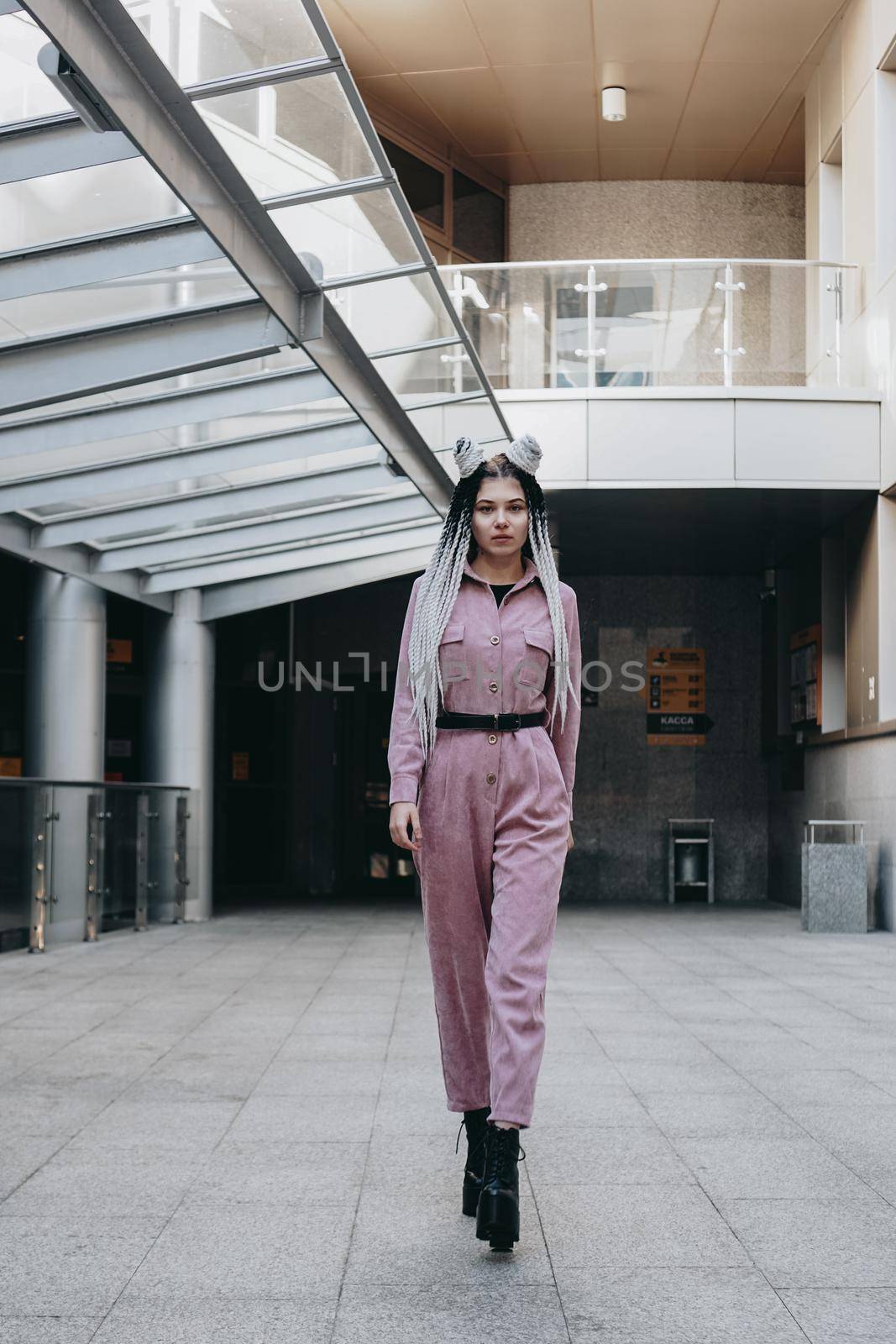 Beautiful cool girl with dreadlocks full length. Photo in the city by natali_brill