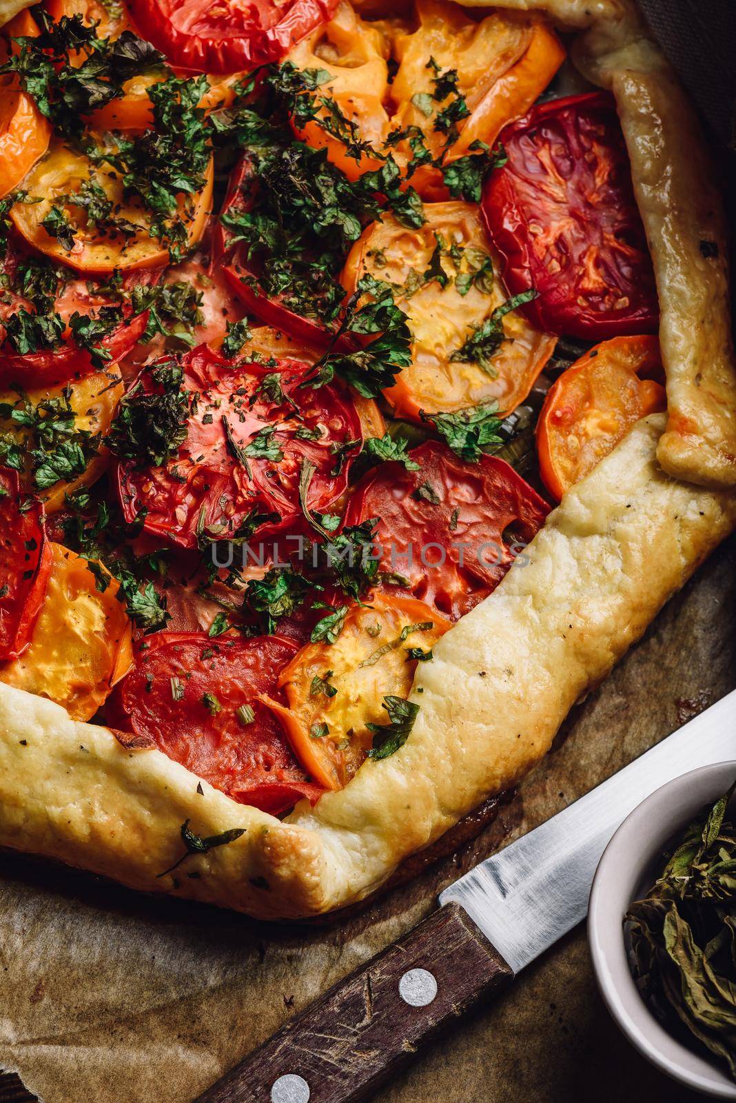 Freshly baked tomato galette on baking paper