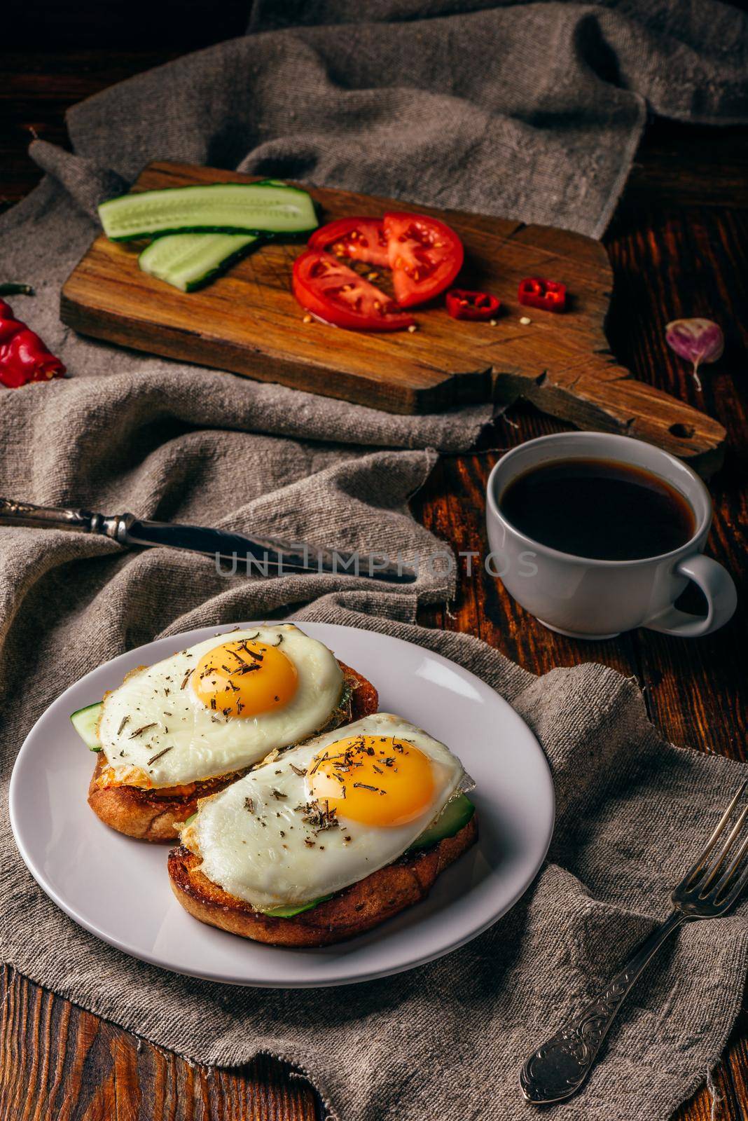 Bruschettas with vegetables and fried eggs with cup of coffee  by Seva_blsv